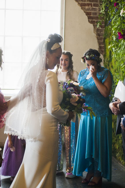 Tears of joy: Twin sister and Maid of Honor Erin gets emotional looking at bride Megan. Both wear custom Brooks LTD.